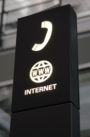 sign in the airport indicating phones and internet are available