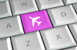 a key on a computer keyboard that has a pink airplane on it