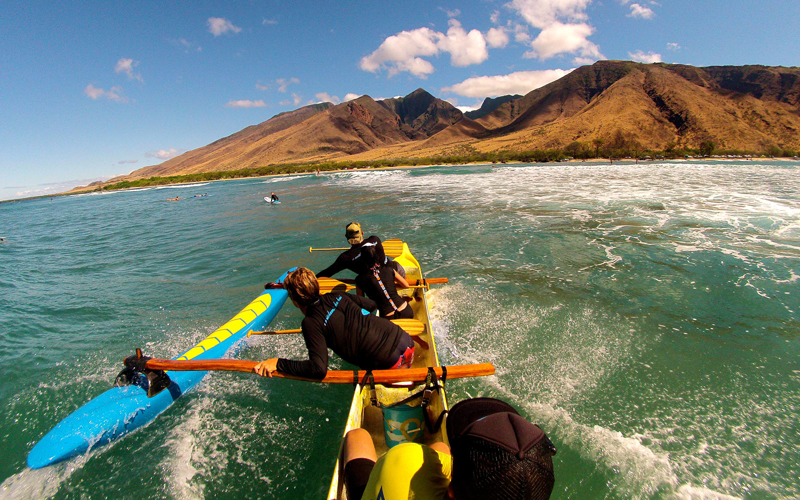 In Maui, Surfing the Waves in an Outrigger Canoe 