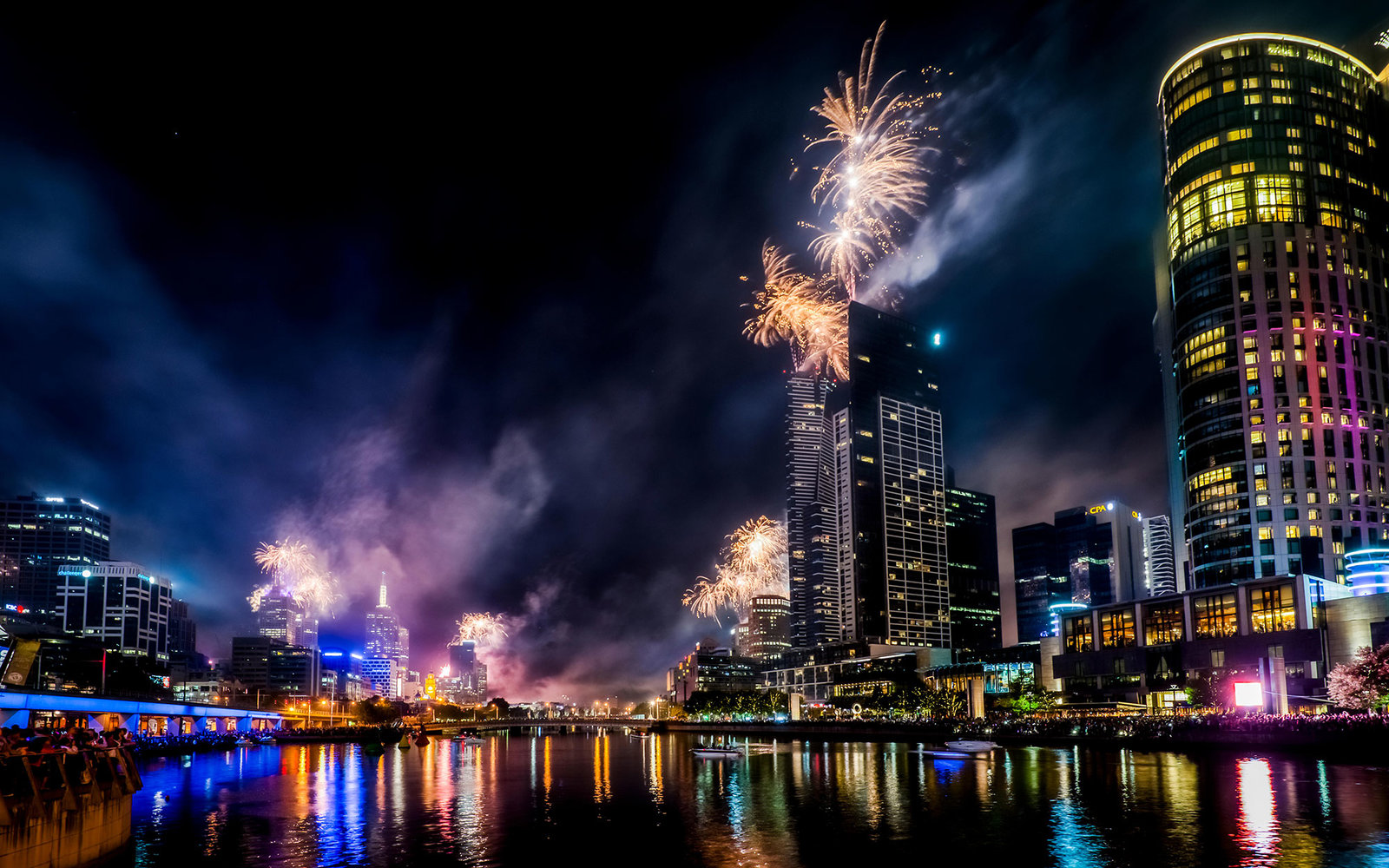 Spectacular fireworks along the Yarra River light up the night sky over Melbourne Australia.