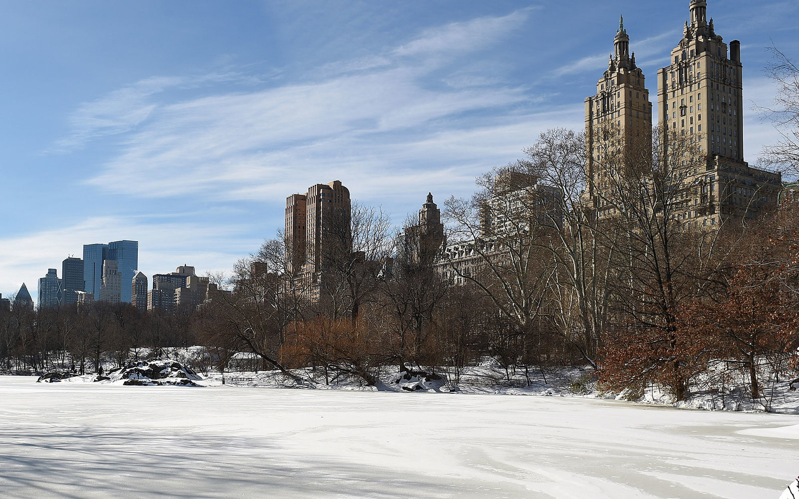 NEW YORK, NY - JANUARY 24:  A man sits by an ice covered lake in Central Park on January 24, 2016 in New York, City. Most of New York's streets were cleaned up over night after a huge snow storm slammed into the mid Atlantic states including New York. (Ph