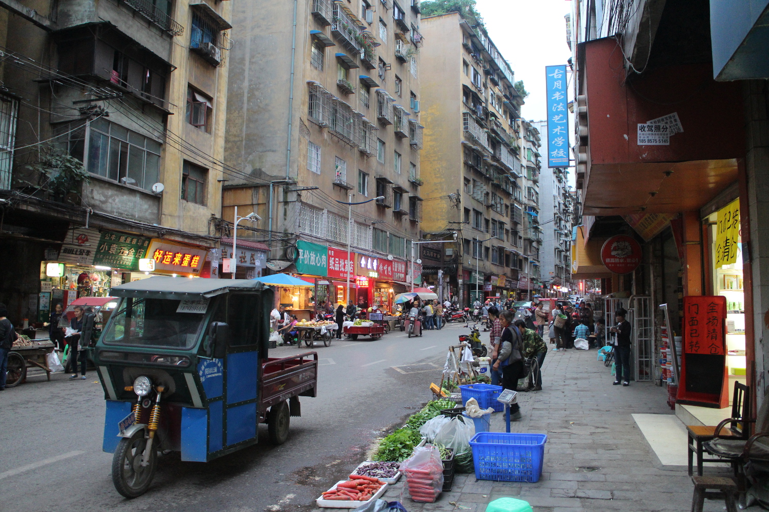 From from the revolution: busy market street of modern Zunyi. Image by Thomas Bird / londoninfopage