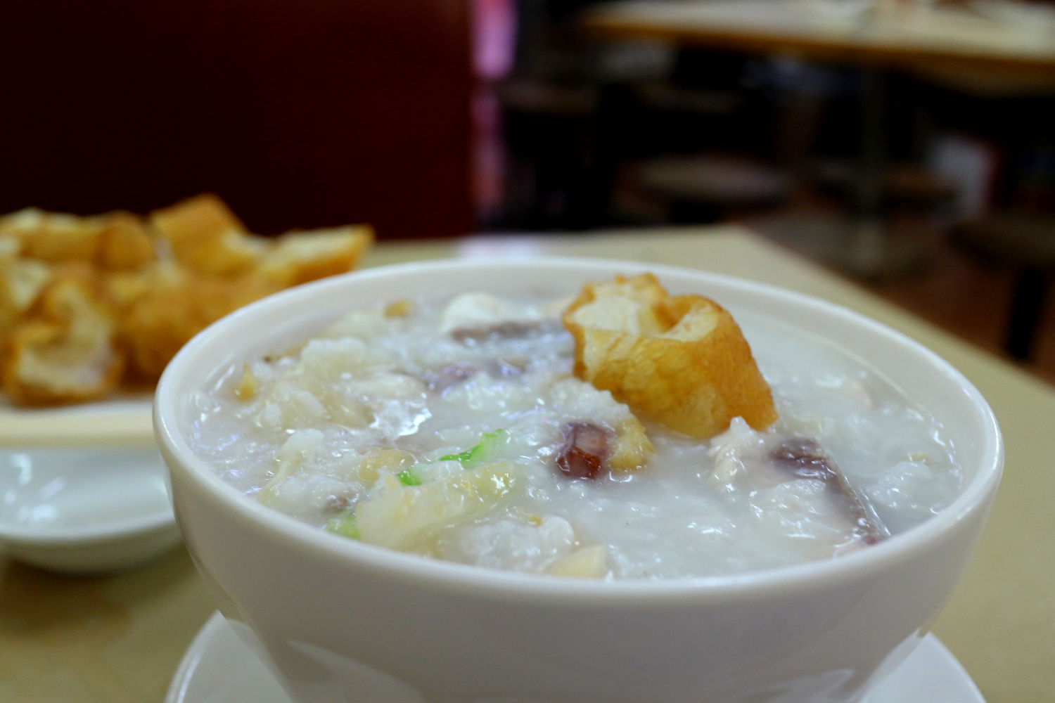'Fisherfolk' congee with seafood and peanuts, and a side of Chinese crullers. Image by Piera Chen / londoninfopage